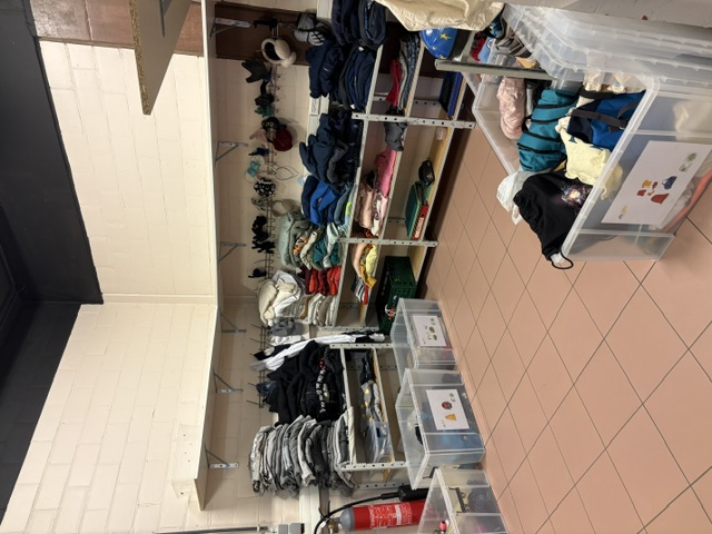 Picture of shelves and boxes with lost items in the Eureka room