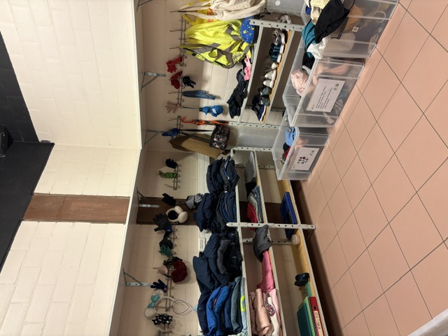 Picture of shelves and boxes with lost items in the Eureka room