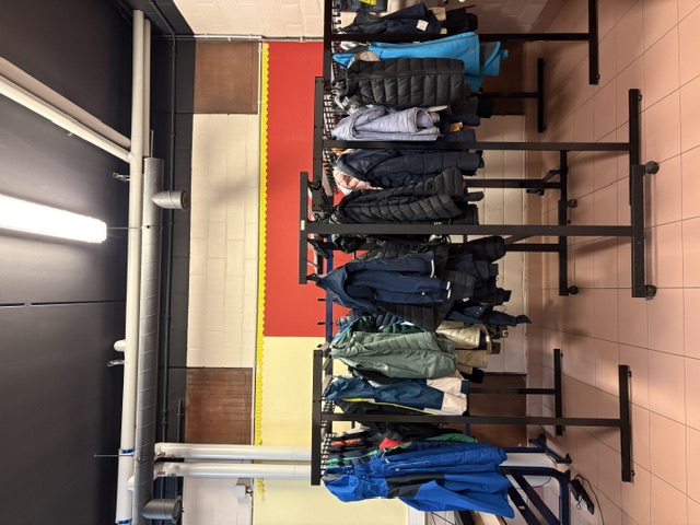 Picture of racks of coats in the Eureka room